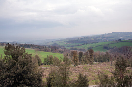 View of the untamed or fallow lands of the Umbria Valley (or Spoleto Valley) at sunset. Collevalenza, Todi, Italy, Europe.
