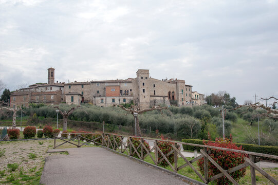 View of the Collevalenza hamlet with the defensive walls and turrets of the castle on  rthe hilltop. Todi, Umbria, Italy, Europe.