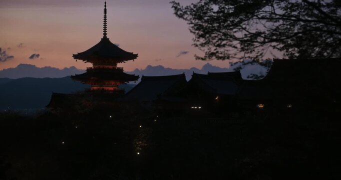 Cinematic silhouette of ancient kiyomizu-dera Japanese temple on hill at dusk