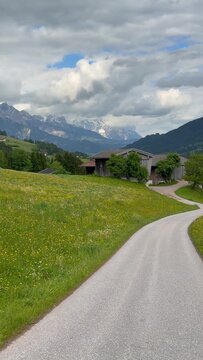 Alpine scenery with old wooden hayloft under high mountains, Leogang, Austria