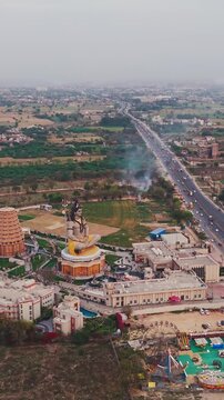 Aerial Drone Shot of Lord Shiva Statue at Char Dham Temple, Vrindavan, Mathura, India
