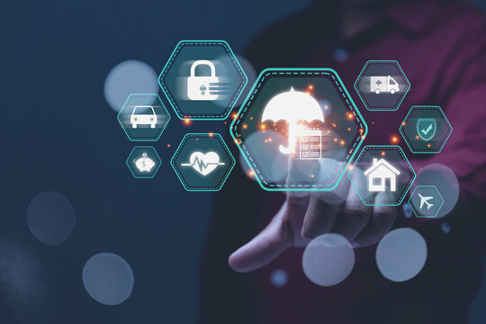 Businessman touching on a virtual umbrella icon symbolises overarching protection and risk management for individuals and businesses.