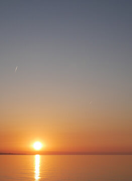 sunrise on the beach, natural light initiation process and vertical shot