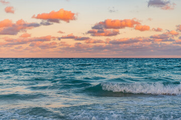 Fototapeta premium Sunset seascape at summer vacation. Horizon with sea cloudy sky. Calm horizon at sea. Sea sunrise on ocean beach. Romantic summer vacation seascape. Seascape horizon paradise. Remote beach