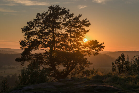 August sunset at the top of Mount Paasonvuori. The surroundings of the city of Sortavala. Karelia, Russia