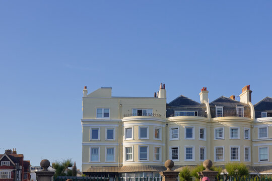 Rooftops under a blue sky on the sea front at Hove in East Sussex, UK