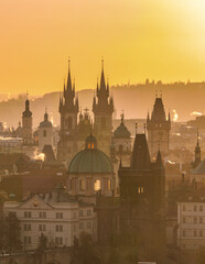 Fototapeta premium Stunning sunrise over Pragues historic skyline with gothic towers and vibrant colors