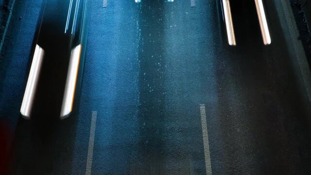 Timelapse of car headlights moving on a highway at night