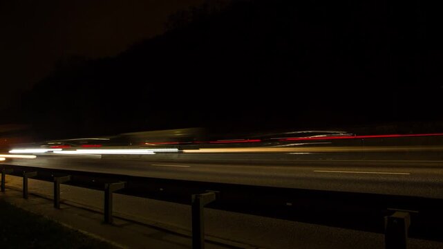 Timelapse of car movement on the highway at night, fast moving lights