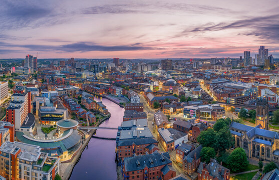 Leeds, Yorkshire, England aerial view of Leeds city centre skyline, modern office buildings, urban streets and golden evening light.