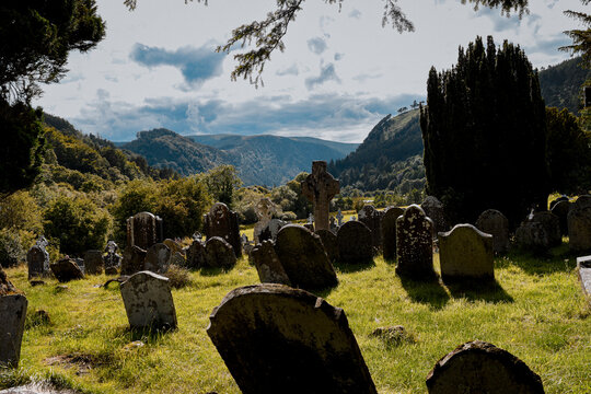 Ancient Celtic crosses and gravestones at Glendalough monastic site, Ireland