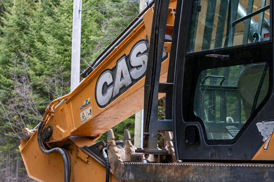 La Tuque, Quebec, 11 May 2026 : A close-up view shows the arm and cabin of a CASE excavator parked outdoors.