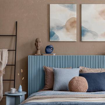 Stylish Bedroom Interior with Blue Headboard, Warm Tones, and Contemporary Decor for Modern Living Space