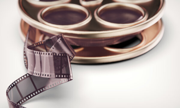 Movie video film disk with retro movie celluloid tape set for vintage reel cinematography. Ultra shallow depth of field. 3D Illustration.