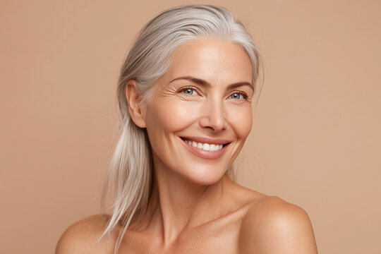 A confident senior woman with silver hair and a warm smile, exuding grace and elegance