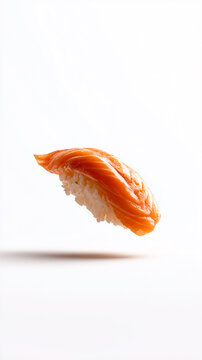 A delicious salmon sushi nigiri hovering over a white surface, ready to be enjoyed