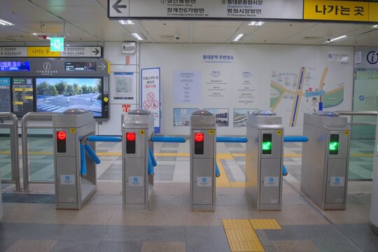 Efficient ticket gates at a clean Seoul subway station for urban transit.