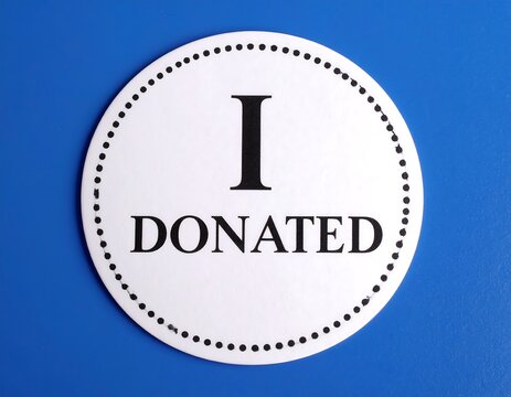 Round white sticker with black text