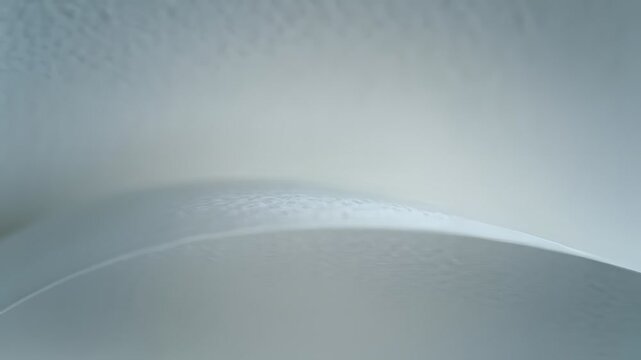 Abstract white curved layers with soft shadows and fluid motion