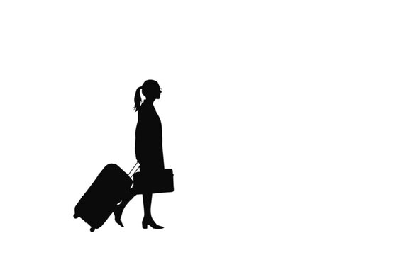 Traveler silhouette walks forward while carrying a heavy suitcase and a bag at the airport terminal to begin a journey toward a distant destination for an upcoming business or vacation trip.