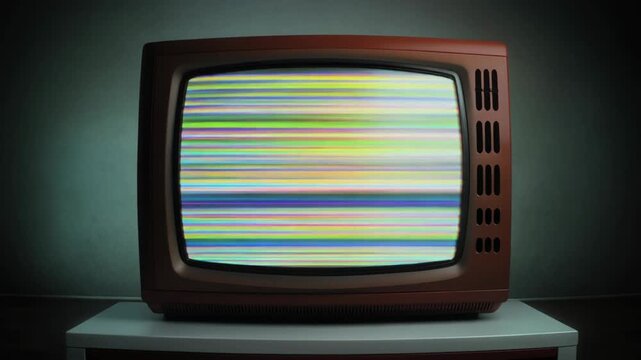 Retro TV displays static noise on a white stand