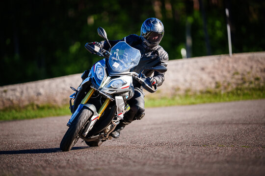 Regular training in Riga, Latvia,  Bikernieki on 12-05-2026  Motorcyclist leaning into a corner on a twisty road