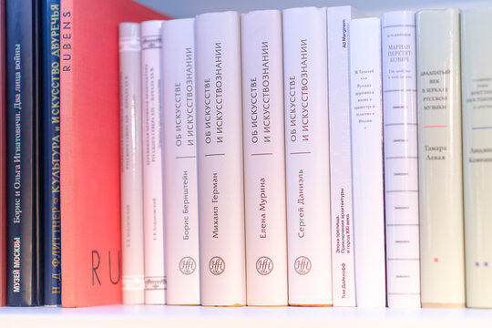 Moscow, Russia - May 11, 2026: Collection of art books displayed on a shelf, featuring titles in Russian and a prominent red book titled Rubens