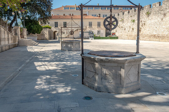 Historic stone wells at Five Wells Square in Zadar Croatia, representing ancient water sources and preservation