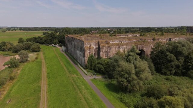 Aerial flight along the concrete flank of Bunker Valentin in Bremen