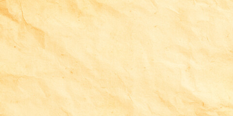 Fototapeta premium Crumpled beige paper texture background with wrinkles and creases