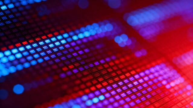 An abstract macro view of a digital screen reveals glowing neon diodes in blue and purple tones, forming an RGB pixel texture that creates a futuristic electronic hardware aesthetic background.