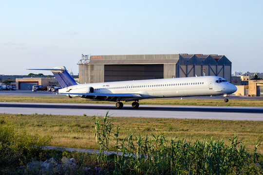 Luqa, Malta - July 8, 2007: McDonnell Douglas MD-82 (DC-9-82) (Reg.: YR-MDL) with thrust reversers on touch down.