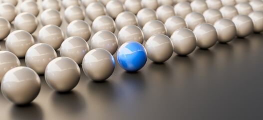 Naklejka premium Leadership concept, blue leader ball, standing out from the crowd of silver balls, on black background. 3D Rendering