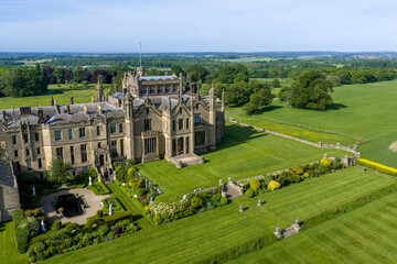 Allerton Castle, North Yorkshire, England aerial view of the historic Gothic revival stately home and luxury wedding venue surrounded by gardens, woodland and Yorkshire countryside. © Chris Chambers