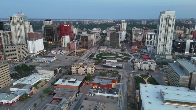 Aerial view of downtown Edmonton skyline with modern buildings all at sunset. 