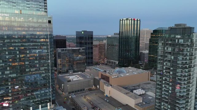 Aerial view of downtown Edmonton skyline with modern buildings all at sunset. 