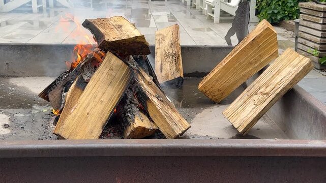 Slow motion logs burning in outdoor fire pit