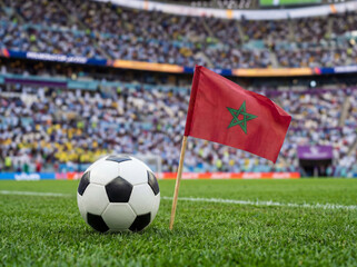 Naklejka premium Moroccan flag on football field with ball in stadium