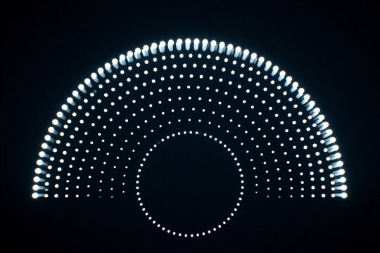 Abstract glowing semicircle and circular dot pattern on dark background