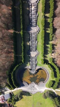 Kassel, Germany - April 6, 2026: Vertical Video Bergpark Wilhelmsh&ouml;he aerial top down of the cascade pool Kassel