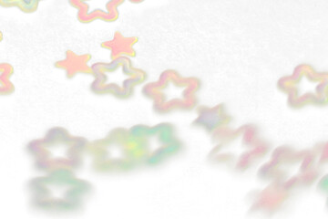 Fototapeta premium Iridescent star confetti scattered during a festive celebration with soft diffused lighting isolated on transparent background