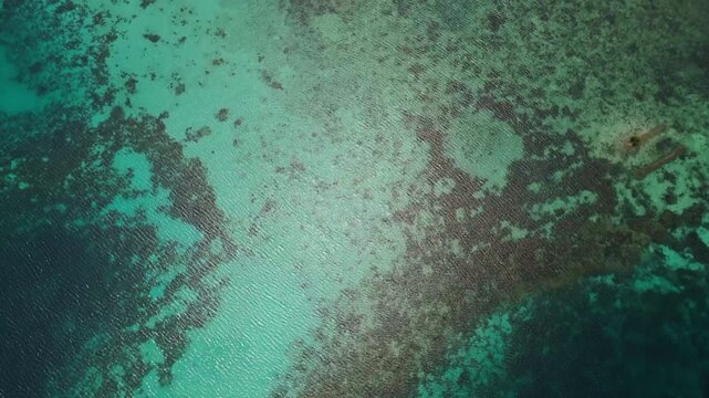 Epic cinematic tracking shot over majestic coastal landscapes of Banggai Sulawesi &ndash; Hidden tropical paradise islands with calm transparent lagoons, professional marketing video for travel tourism