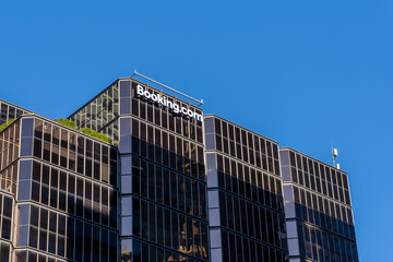 Naklejka premium Toronto, Ontario, Canada - May 30, 2026: Booking.com's Customer Call Centre building on University Ave in Toronto, Ontario, Canada. Booking.com is an online travel agency.