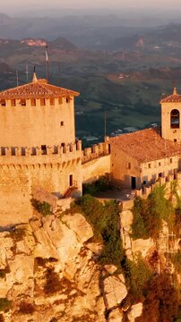 Flying over the amazing hilltop fortresses on Monte Titano in San Marino. San Marino one of the smallest countries in the world. Vertical Video.