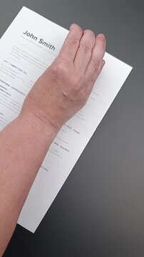 Human Review Required stamp on Fake mock CV (curriculum vitae) resume, concept of ATS auto-screening, AI filtering, and manual recruiter evaluation.