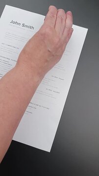 No Human Review stamp on fake Fake mock CV (curriculum vitae) resume, concept of fully automated ATS screening, AI-only filtering,and no recruiter involvement.