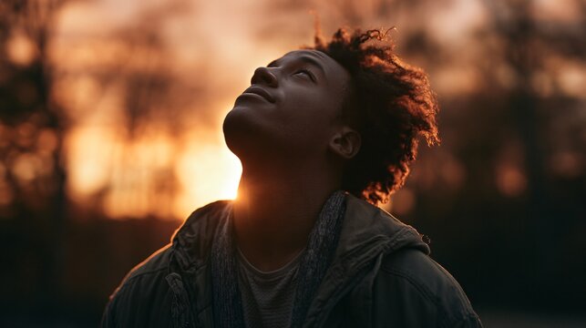 Young Man Admiring Sunset Outdoors