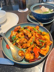 Fototapeta premium Spicy Seafood Stir Fry in Restaurant Setting, Delicious Asian Cuisine Served Fresh