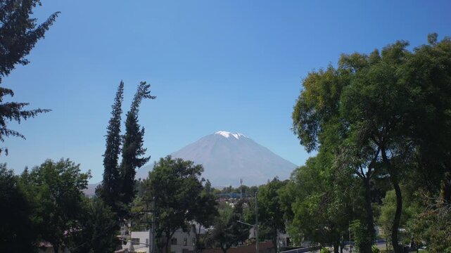 Misti volcano seen through trees in the city of Arequipa, Peru.