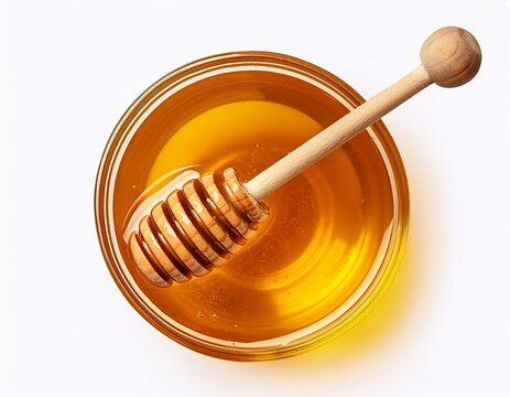 glass bowl of pure honey with honey dipper isolated on a white background cut out in png format for graphic design isolated on a white background top view